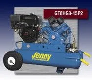 A blue air compressor with a gas engine attached to it A blue air compressor with a gas engine attached to it